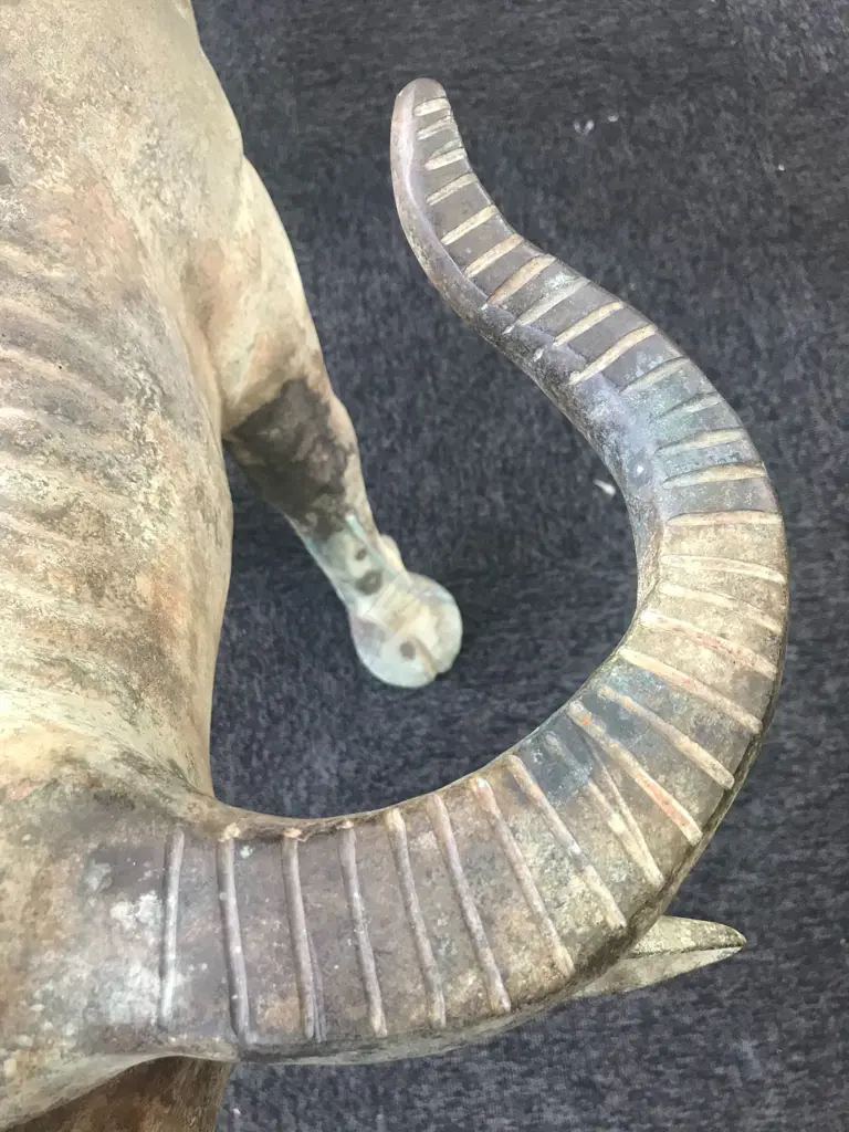 An old and well modelled bronze statue depicting the Zen Buddhist expression of spirit - Riding the Bull Home Image 1++