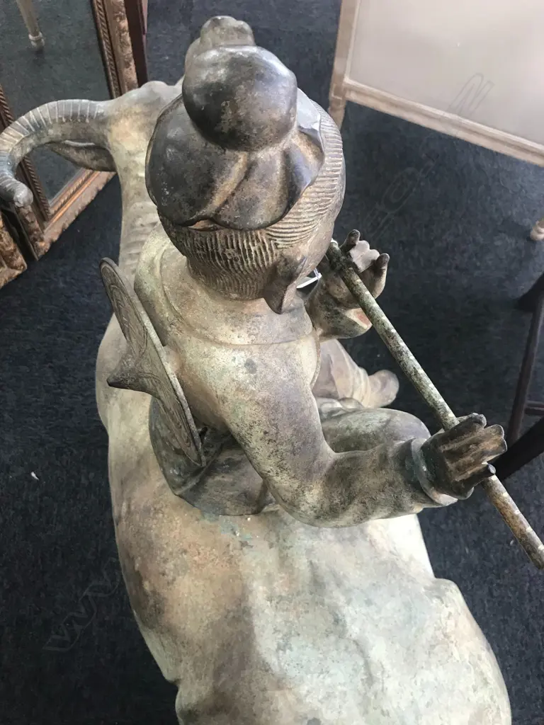 An old and well modelled bronze statue depicting the Zen Buddhist expression of spirit - Riding the Bull Home Image 1++