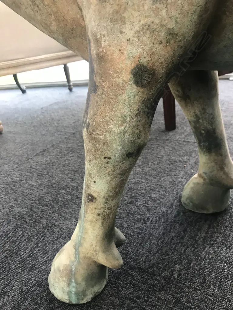 An old and well modelled bronze statue depicting the Zen Buddhist expression of spirit - Riding the Bull Home Image 1++