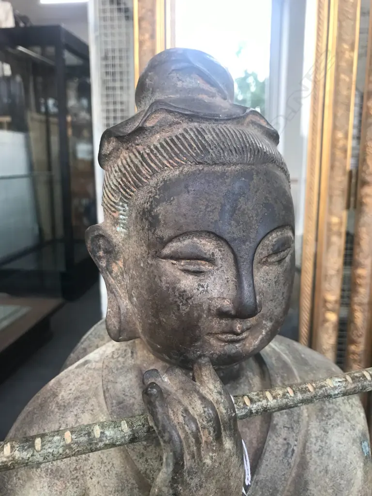 An old and well modelled bronze statue depicting the Zen Buddhist expression of spirit - Riding the Bull Home Image 1++