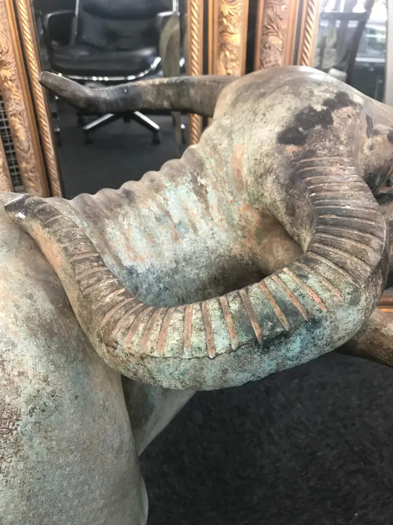 An old and well modelled bronze statue depicting the Zen Buddhist expression of spirit - Riding the Bull Home Image 1++