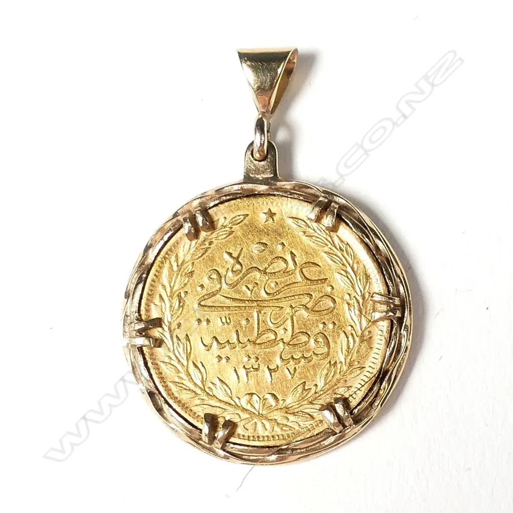A Turkish gold 100 kurush coin in gold pendant mount Image 1++