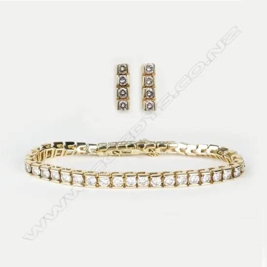 An 18ct yellow gold and diamond tennis bracelet and earring suite