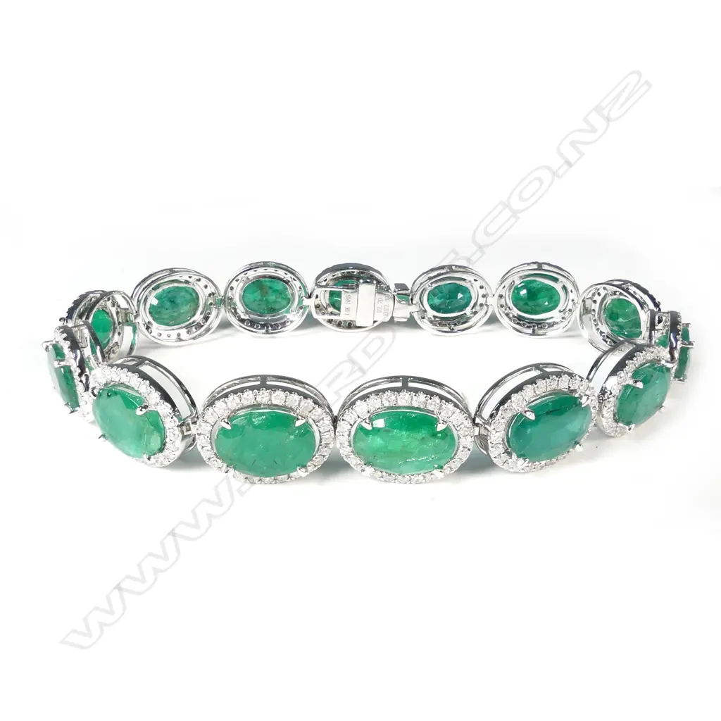 A 14ct white gold emerald and diamond bracelet Image 1++