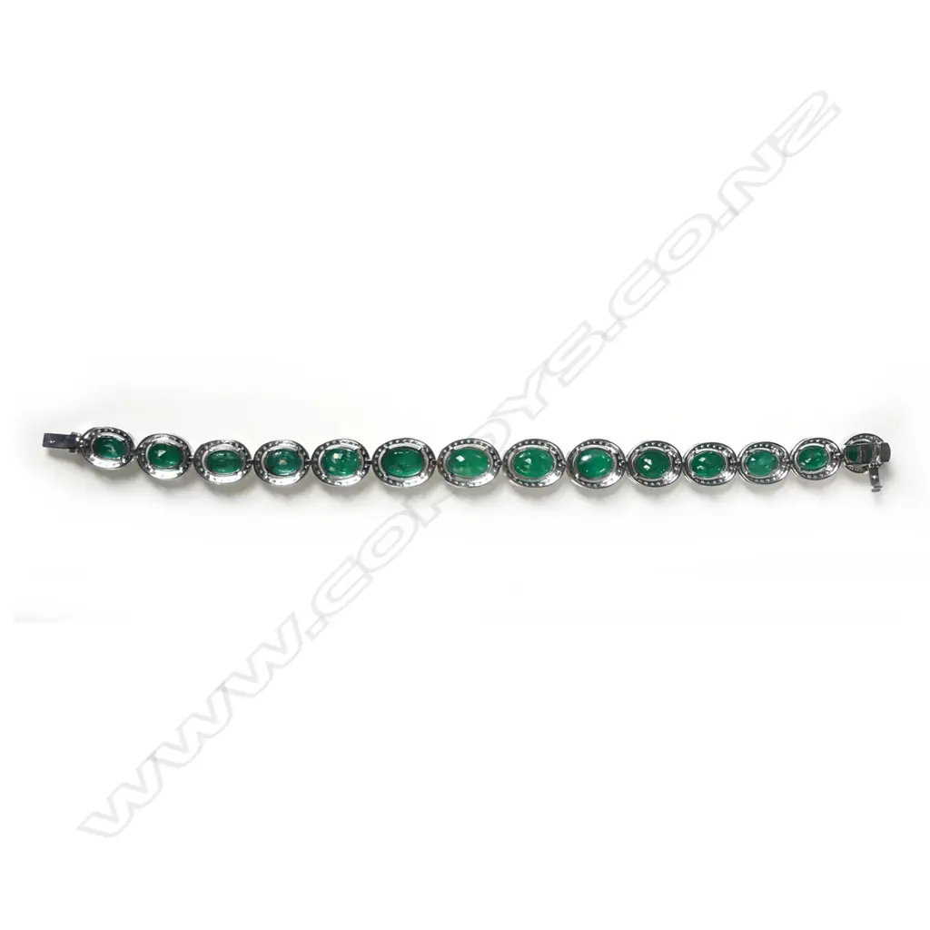 A 14ct white gold emerald and diamond bracelet Image 1++