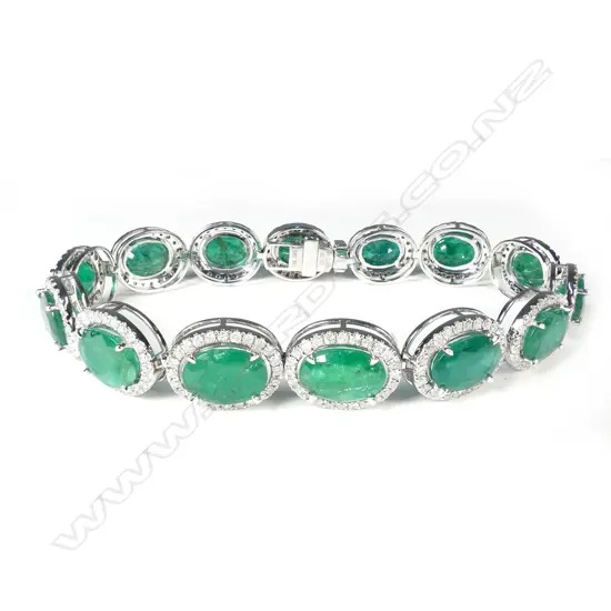 A 14ct white gold emerald and diamond bracelet