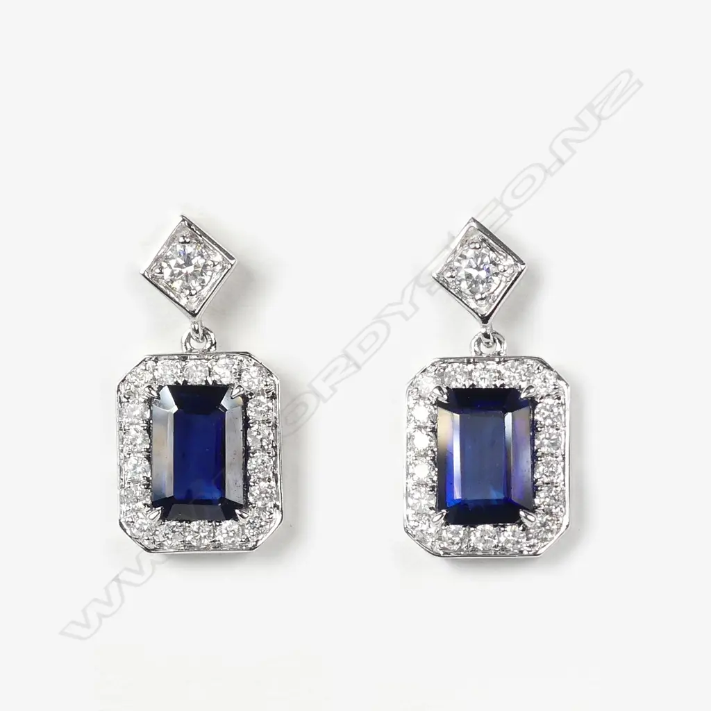 A pair of 14ct white gold sapphire and diamond earrings Image 1++