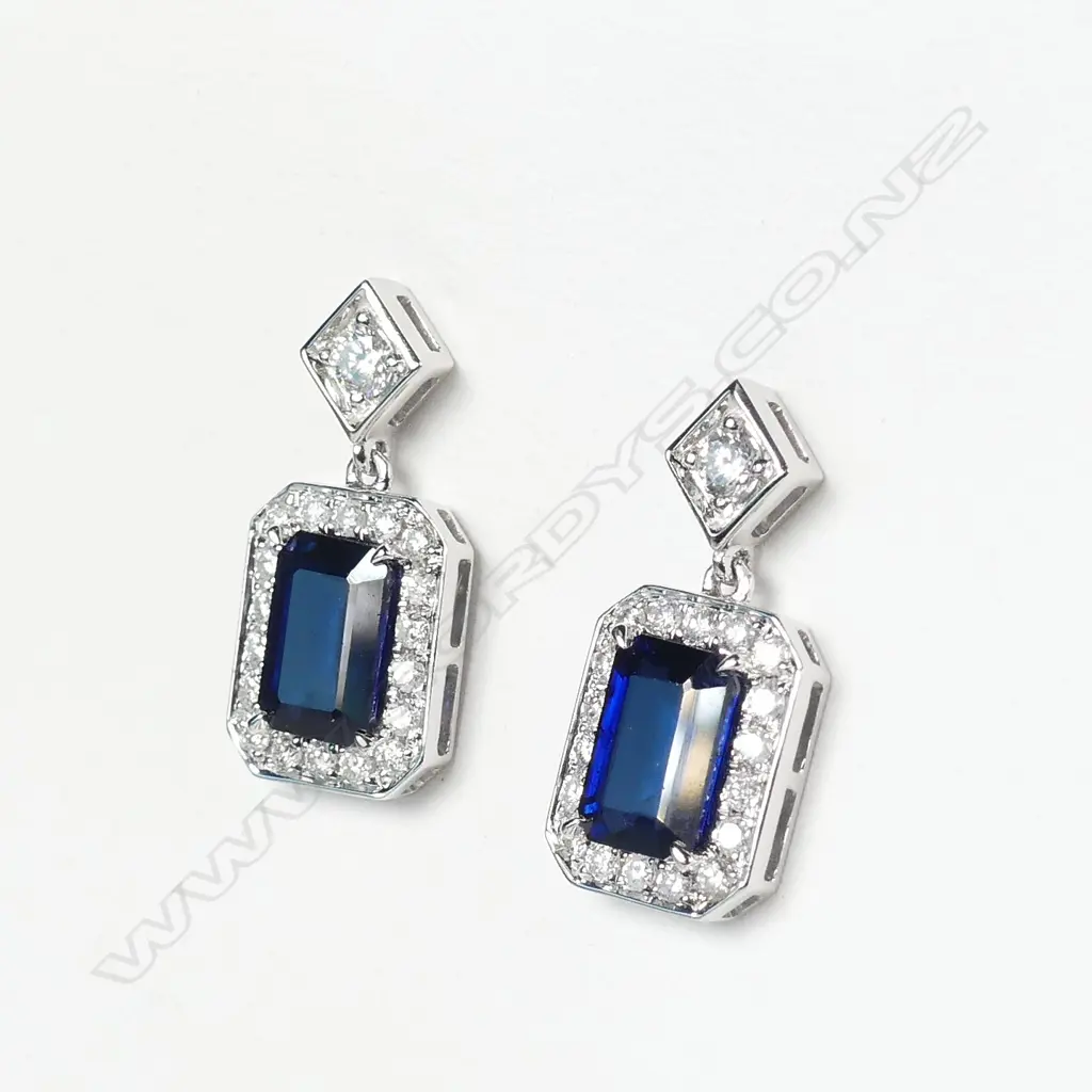 A pair of 14ct white gold sapphire and diamond earrings Image 1++