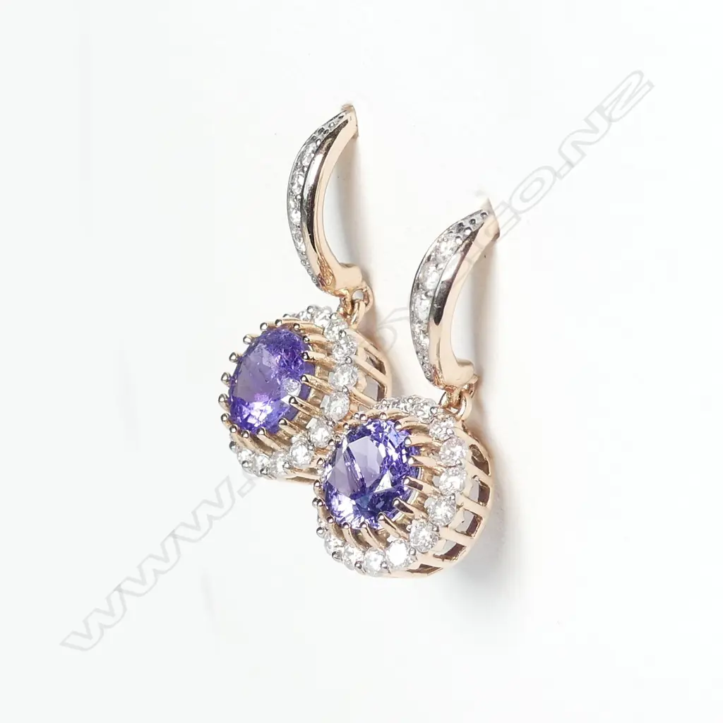 A pair of 14ct rose gold tanzanite and diamond earrings Image 1++