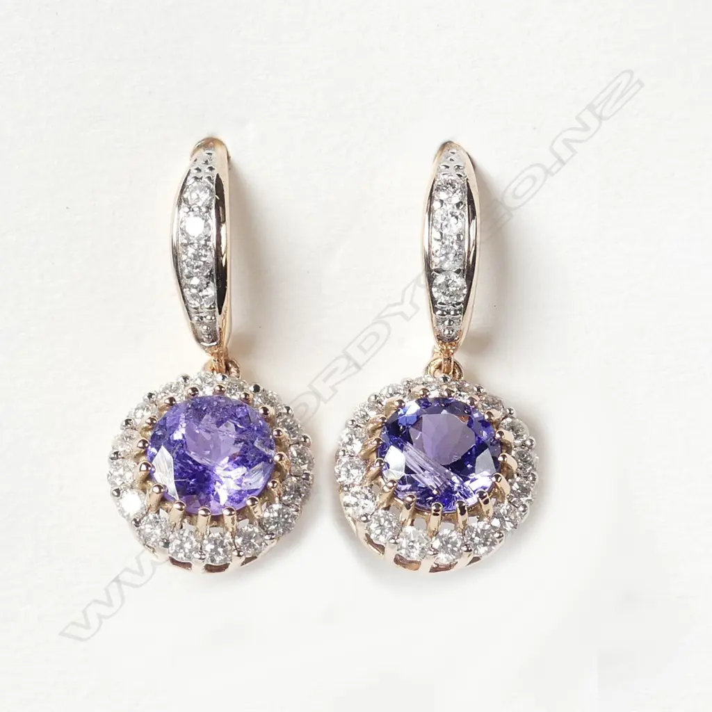 A pair of 14ct rose gold tanzanite and diamond earrings Image 1++