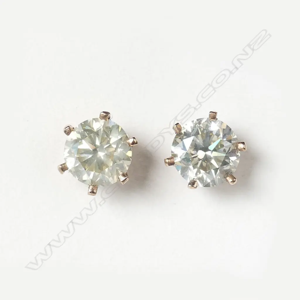 A pair of 14ct rose gold and 4.00ct diamond stud earrings Image 1++