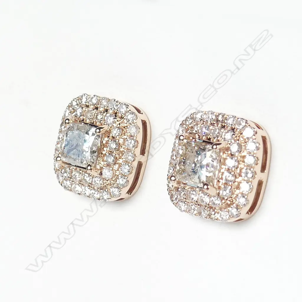 A pair of 14ct rose gold and halo diamond earrings Image 1++