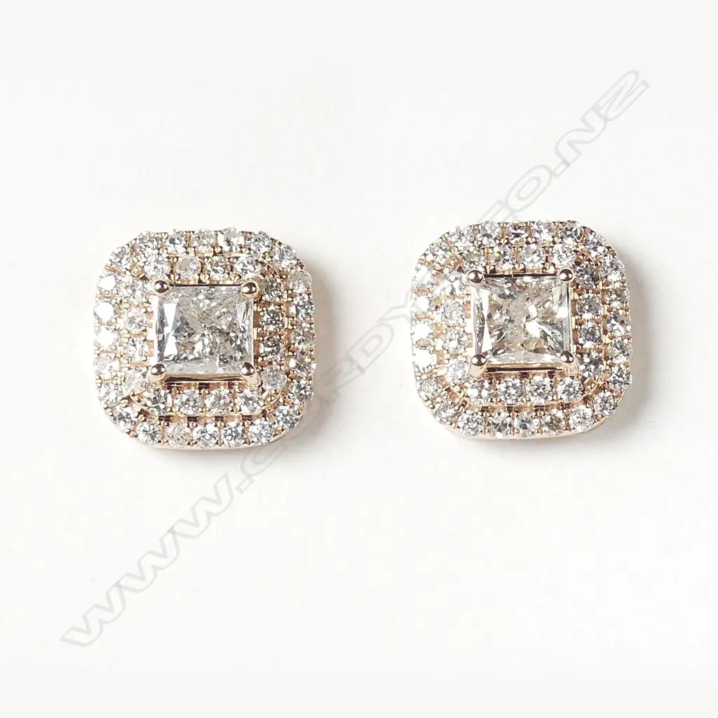 A pair of 14ct rose gold and halo diamond earrings Image 1++
