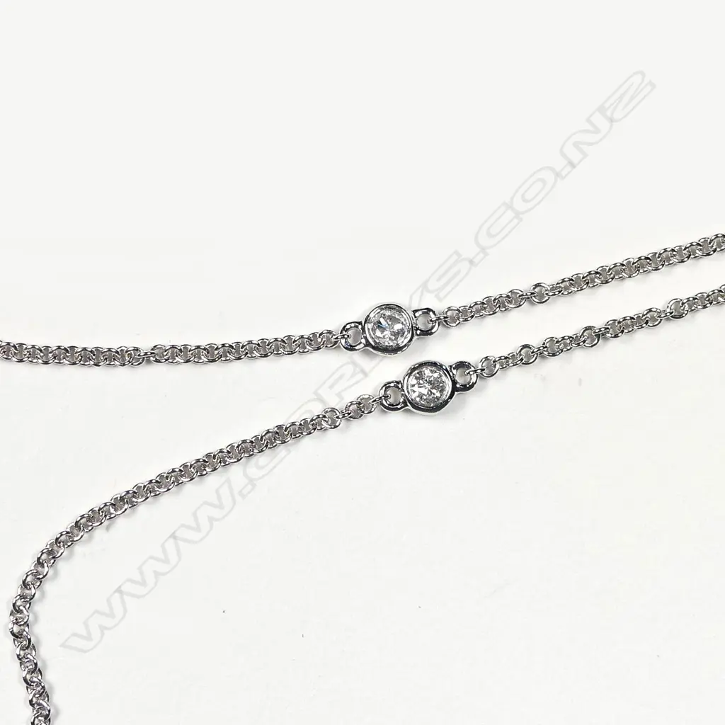 A 14ct white gold emerald and diamond Art Deco style pendant Image 1++