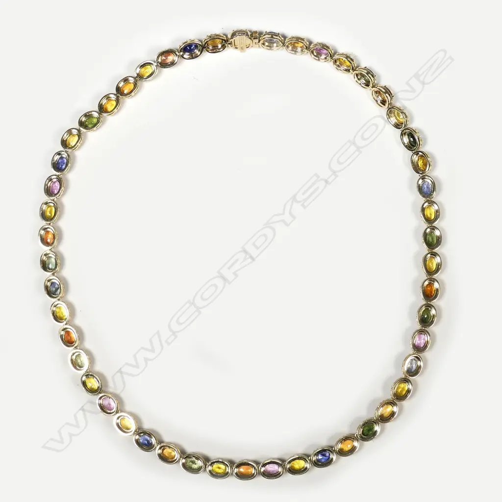 A 14ct gold sapphire and diamond necklace Image 1++