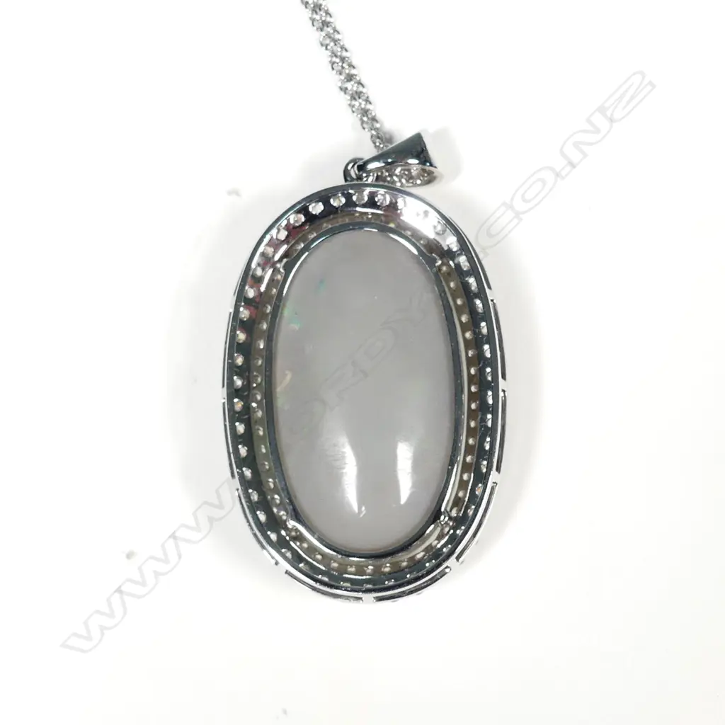 An impressive 14ct white gold opal and diamond pendant Image 1++