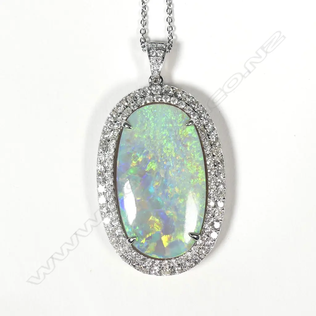 An impressive 14ct white gold opal and diamond pendant Image 1++