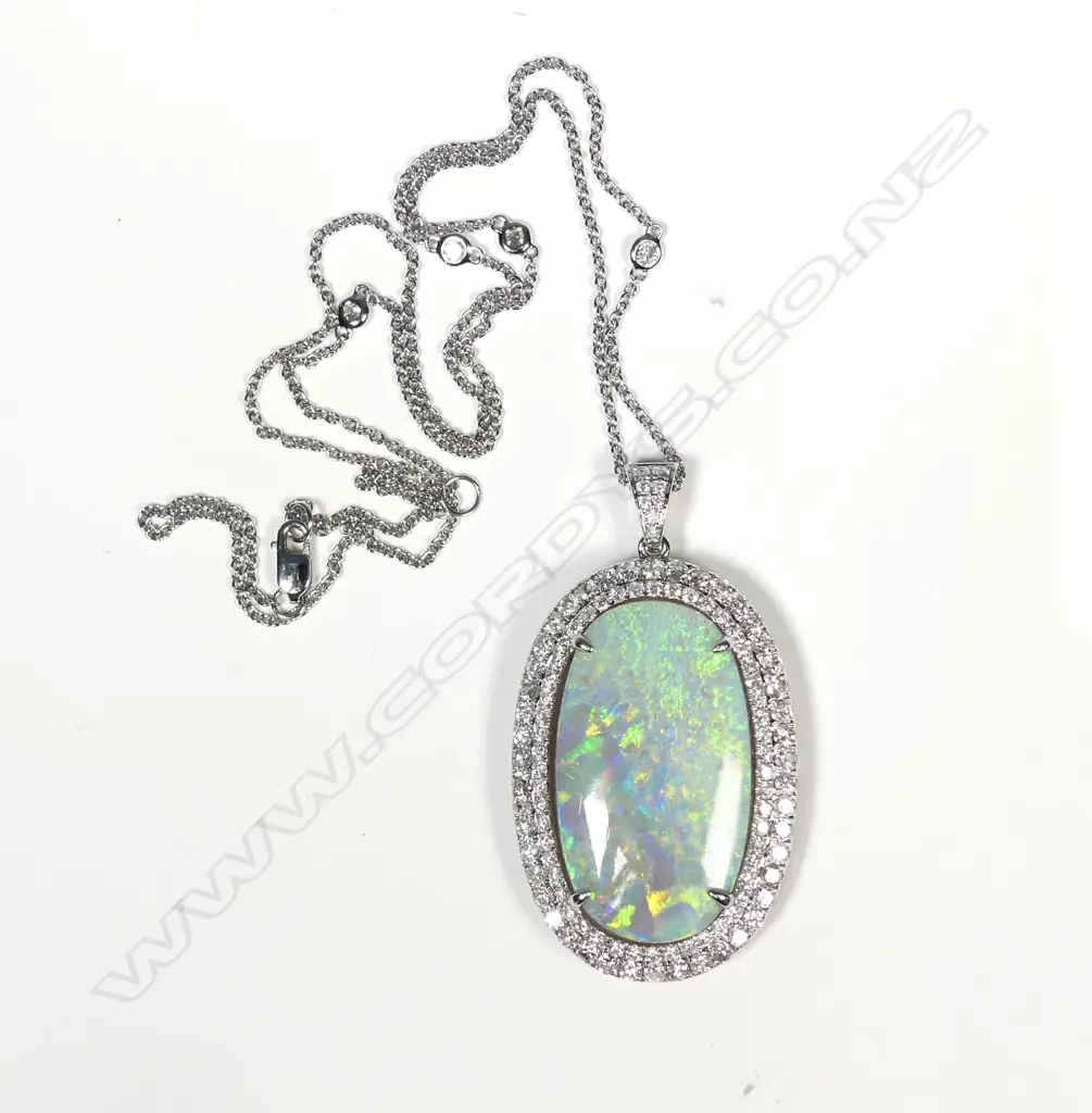 An impressive 14ct white gold opal and diamond pendant Image 1++