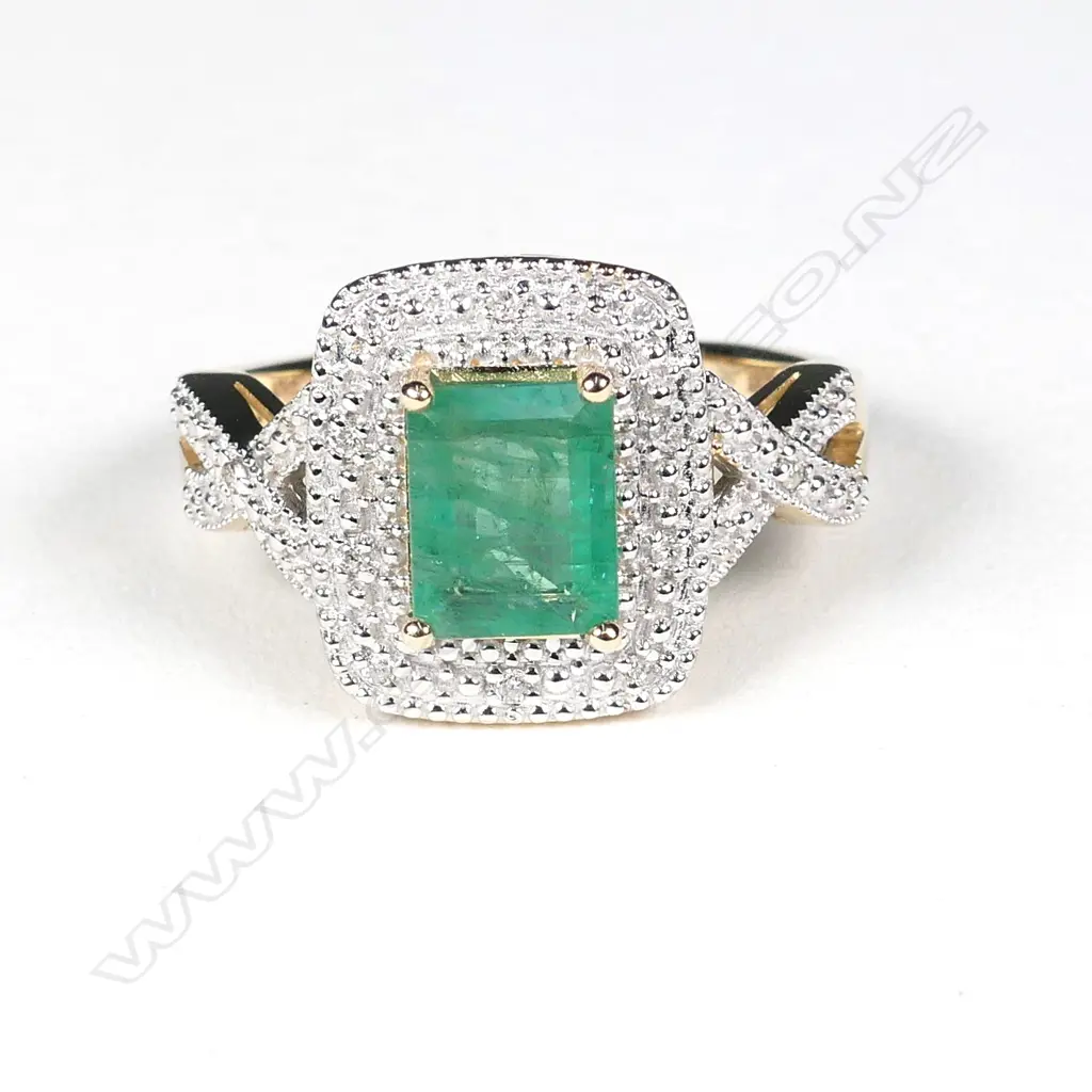A 14ct gold emerald and diamond ring Image 1++