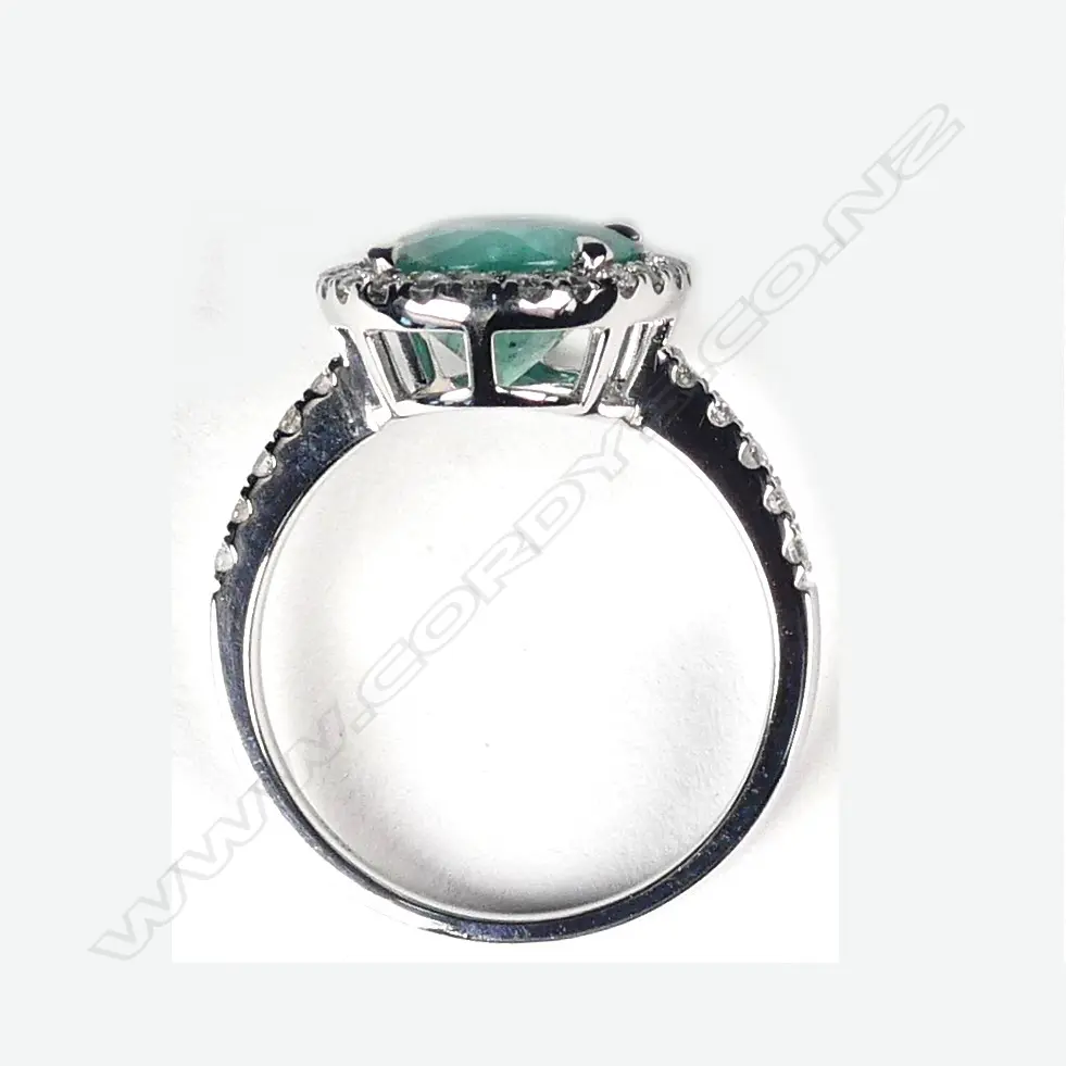 A platinum emerald and diamond ring Image 1++