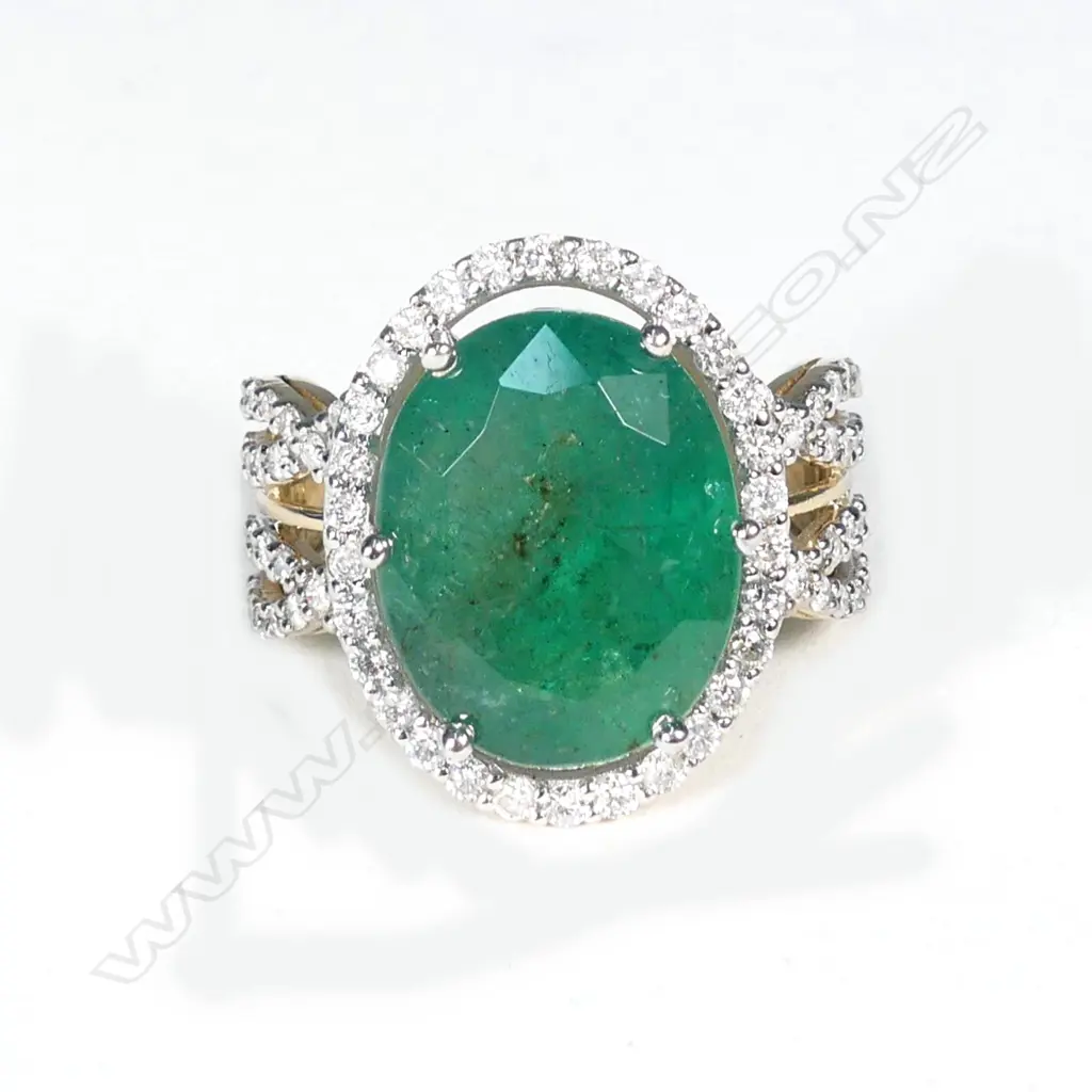 A 14ct gold emerald and diamond ring Image 1++