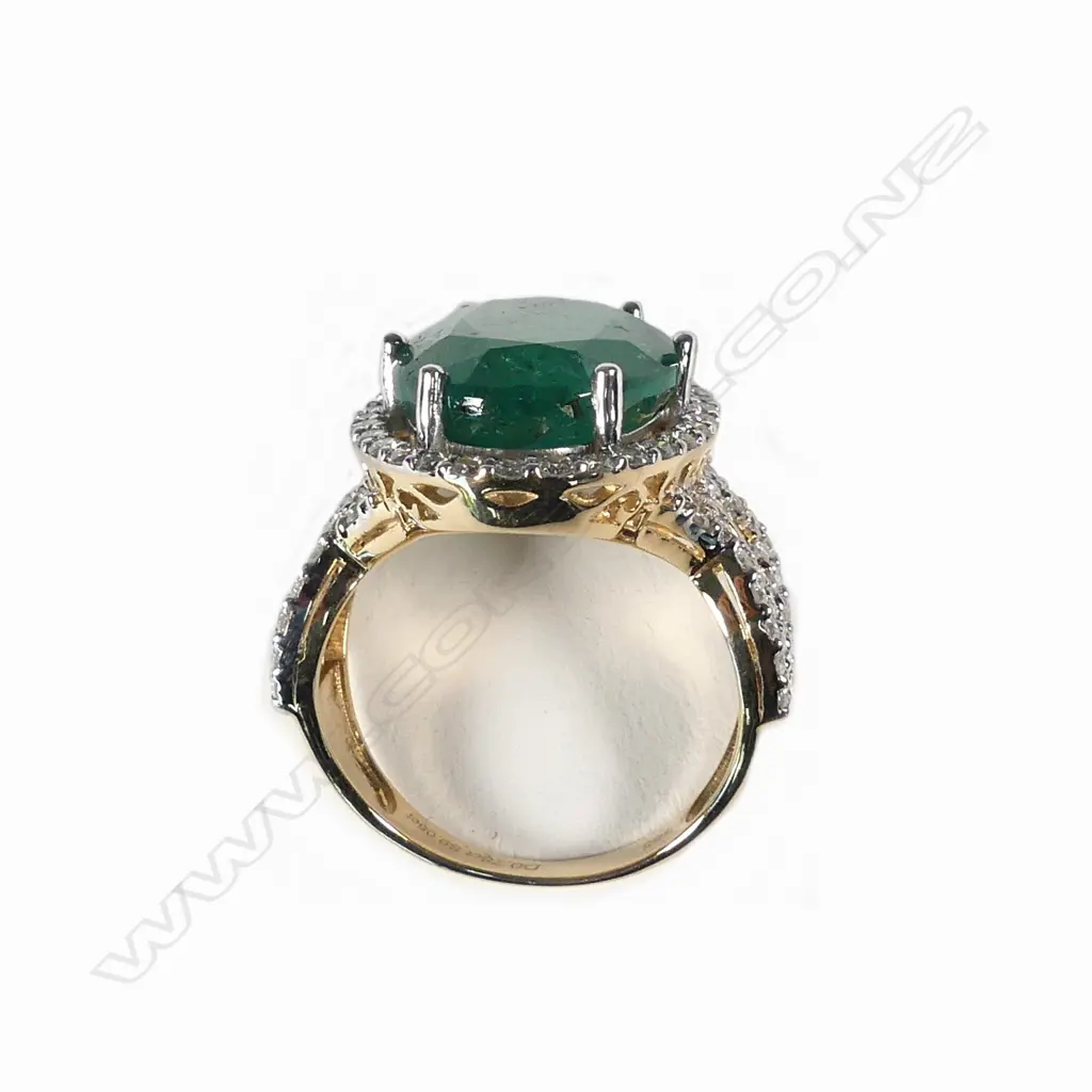 A 14ct gold emerald and diamond ring Image 1++