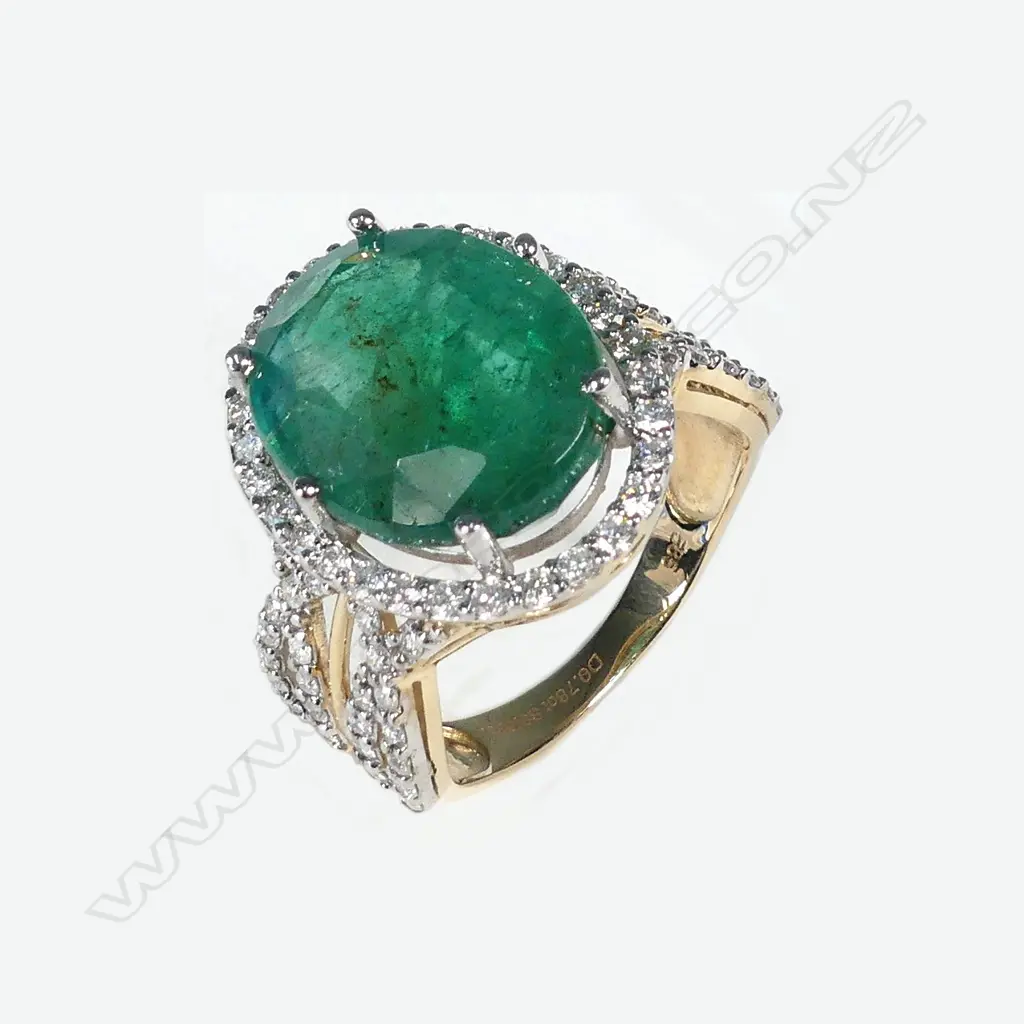 A 14ct gold emerald and diamond ring Image 1++