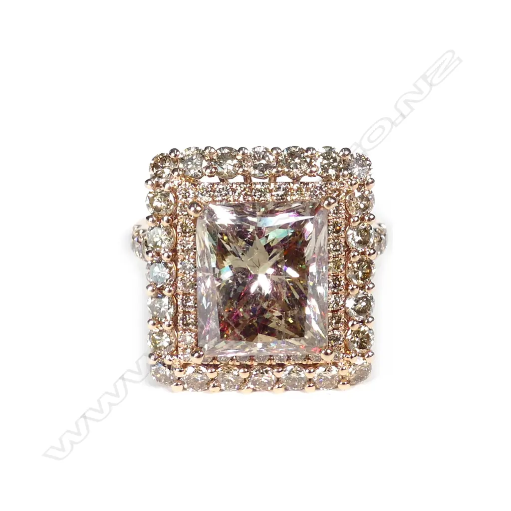 A 14ct rose gold and diamond halo ring Image 1++