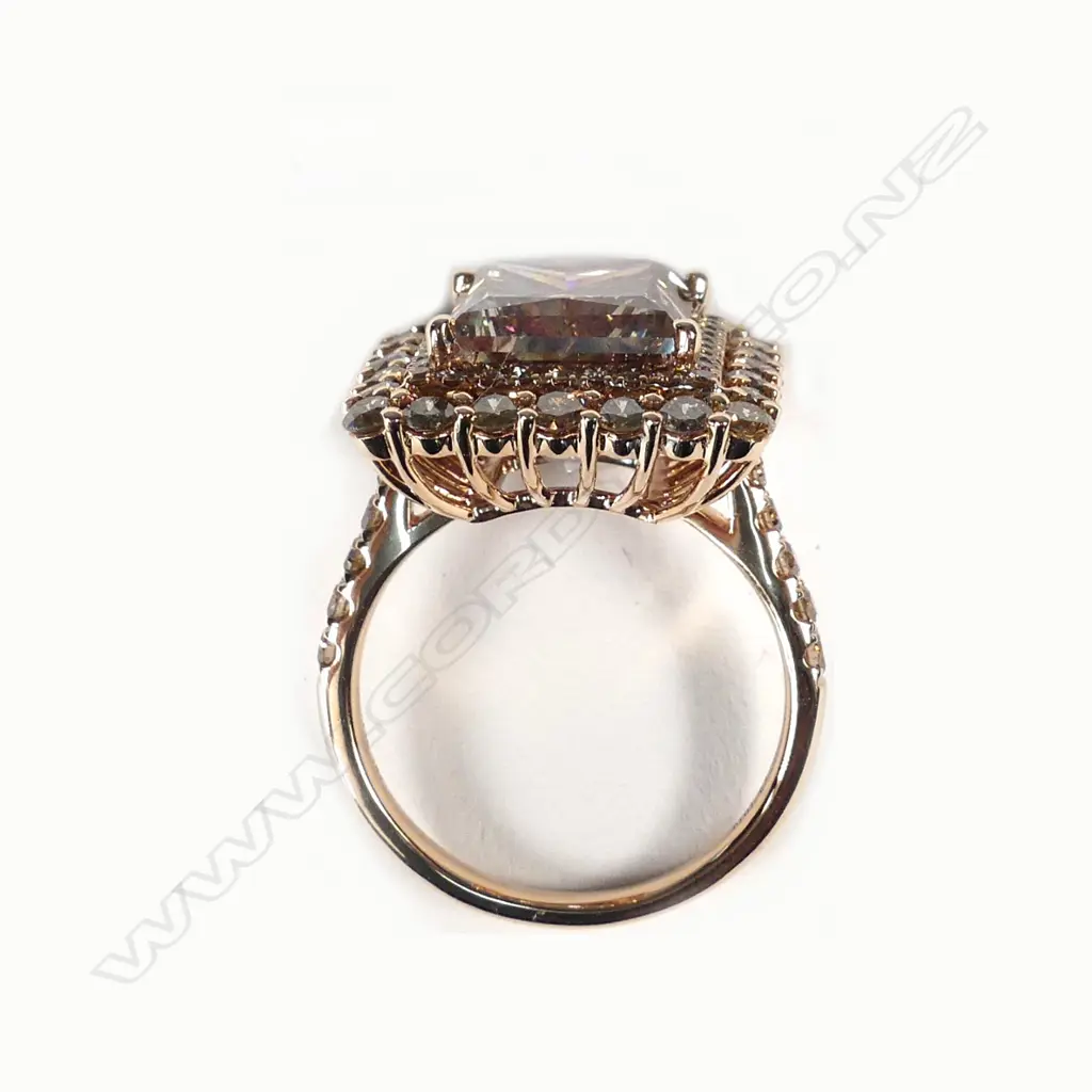 A 14ct rose gold and diamond halo ring Image 1++
