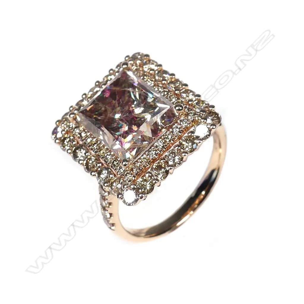 A 14ct rose gold and diamond halo ring Image 1++