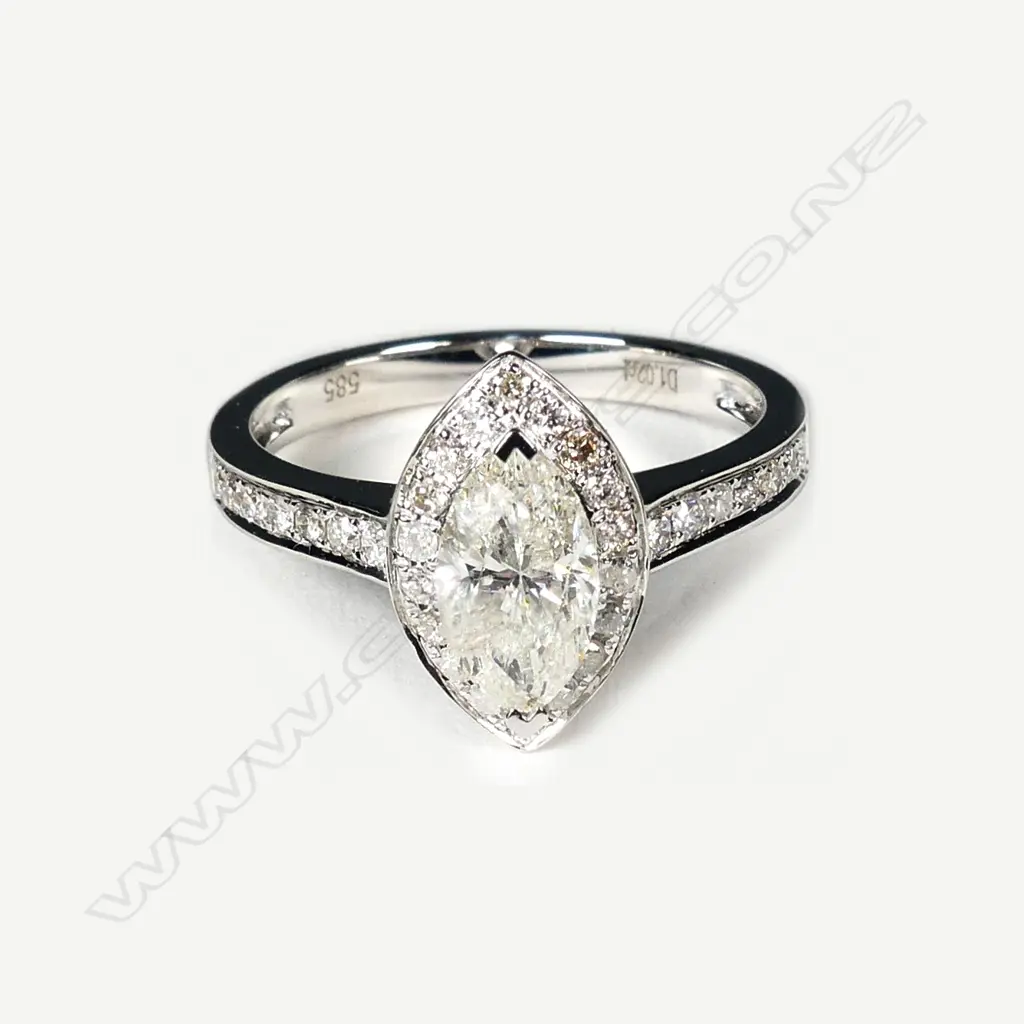 A 14ct white gold and diamond ring Image 1++