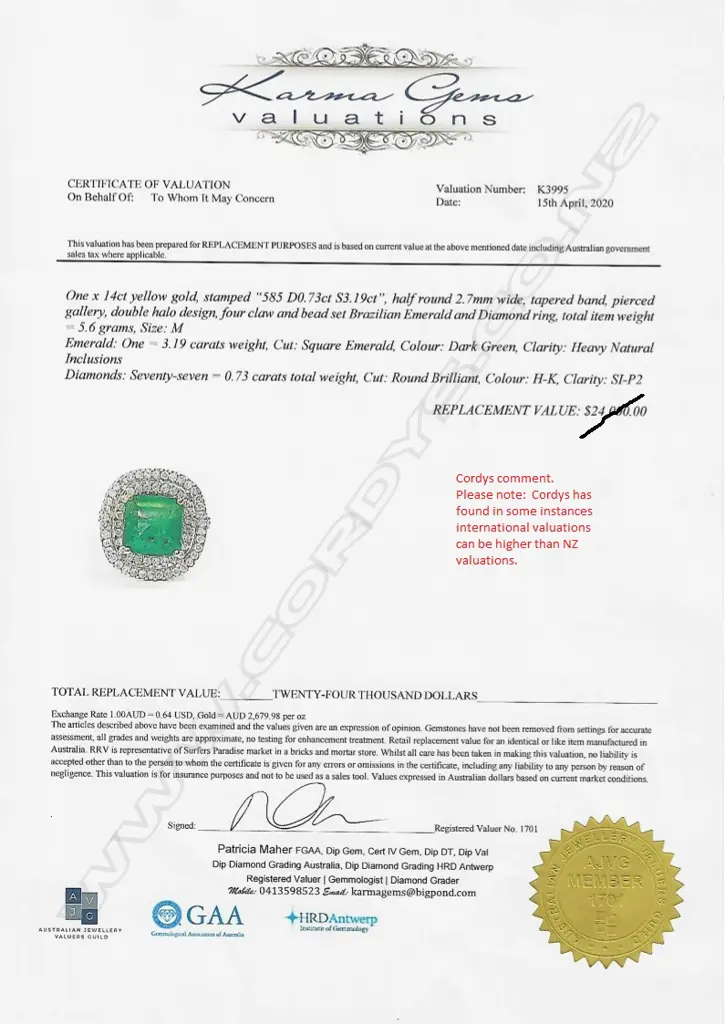 A 14ct gold emerald and diamond double halo ring Image 1++