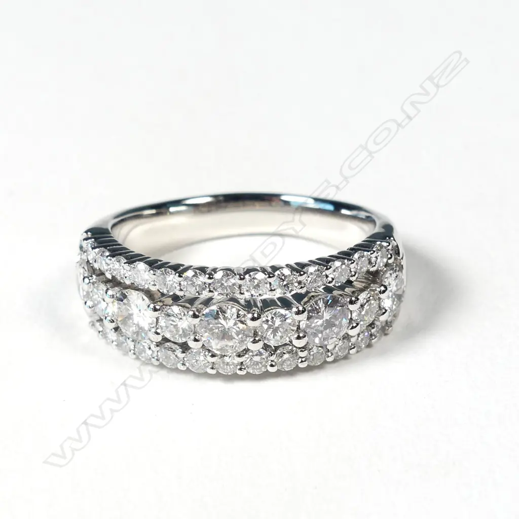 A platinum and diamond ring Image 1++