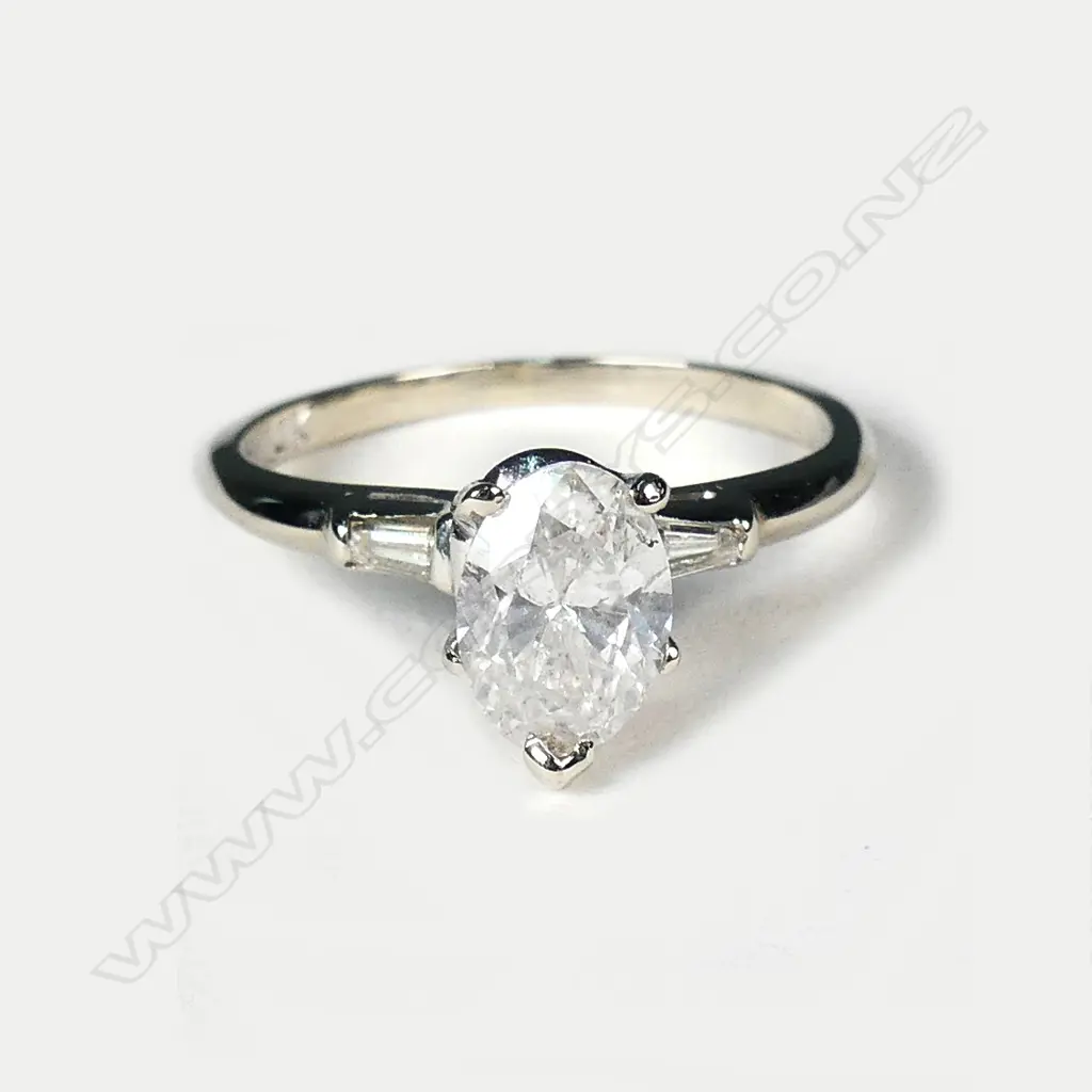 A 14ct white gold and diamond solitaire ring Image 1++