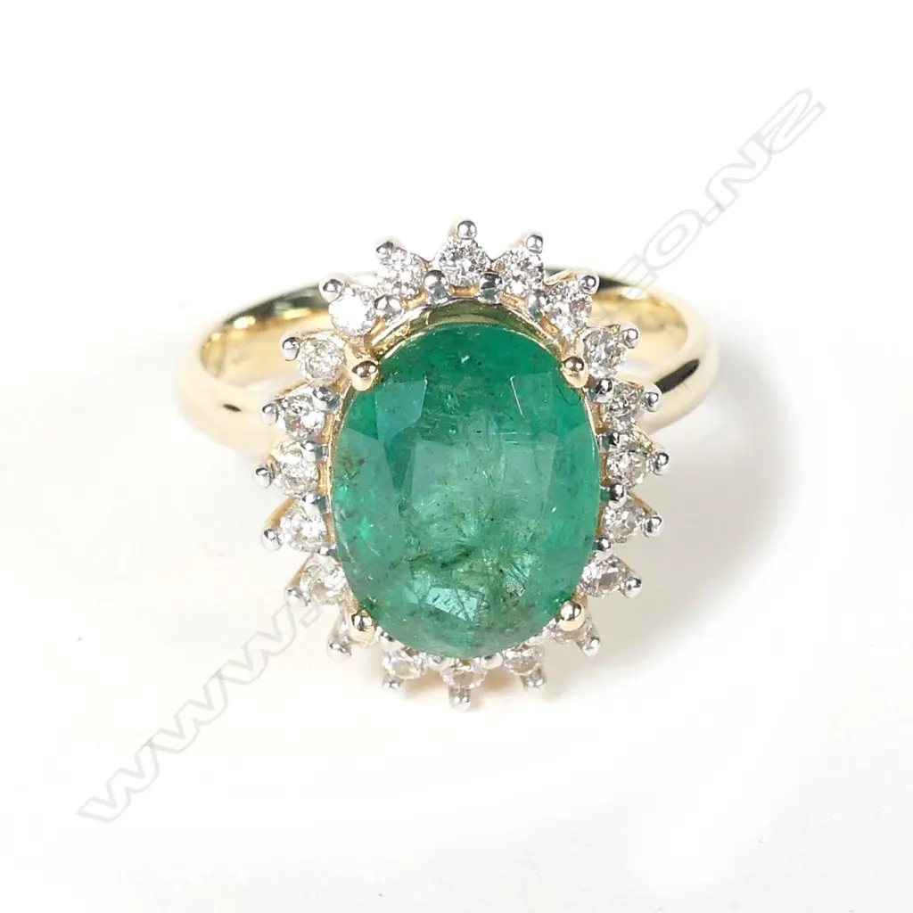 A 14ct gold emerald and diamond ring Image 1++