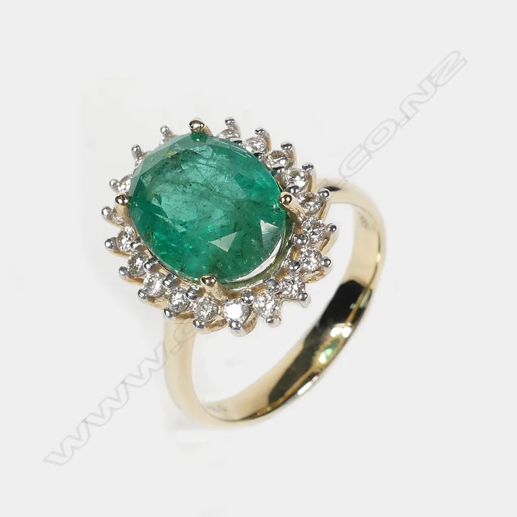 A 14ct gold emerald and diamond ring Image 1++