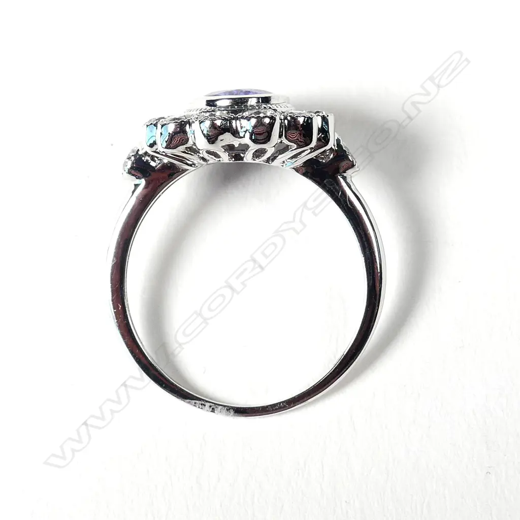 An 18ct white gold tanzanite and diamond ring Image 1++