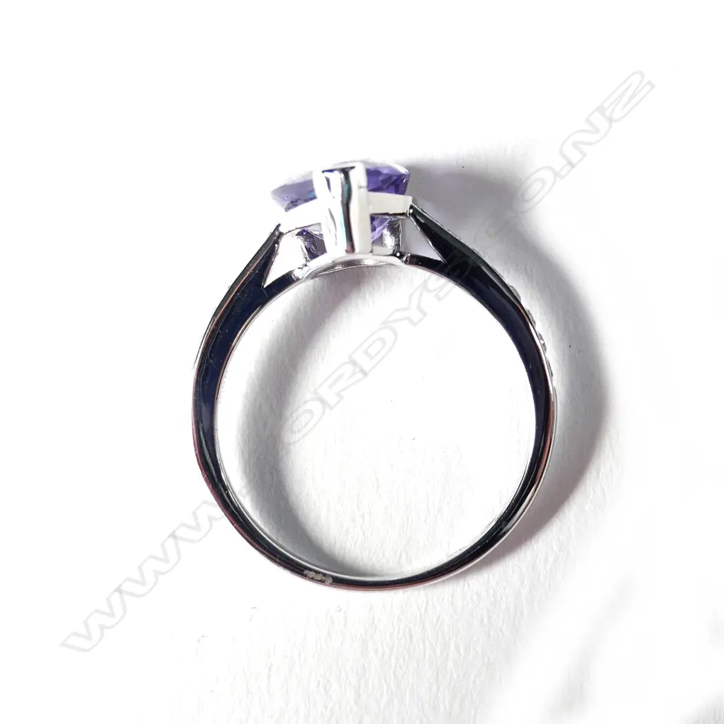A 14ct white gold tanzanite and diamond ring Image 1++
