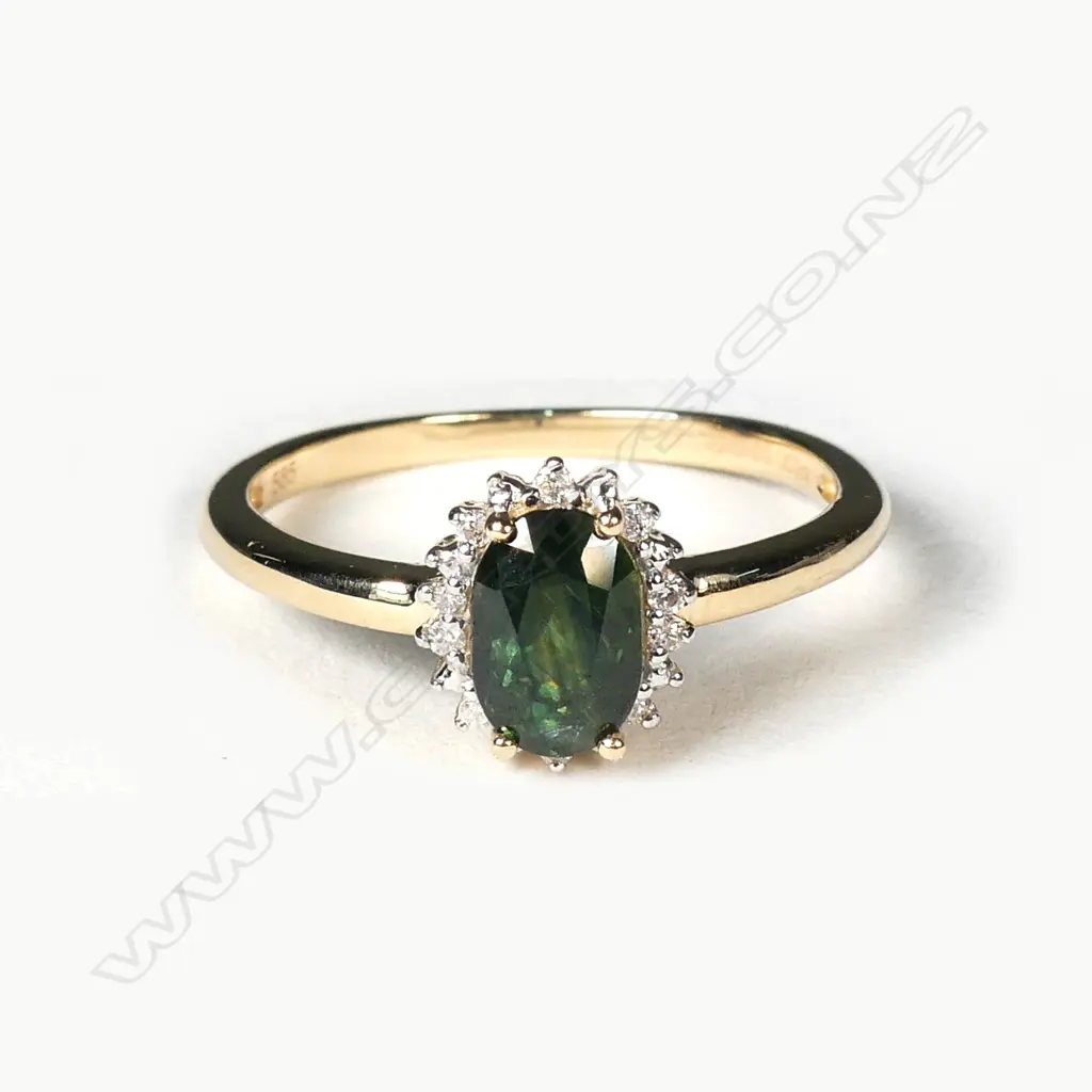 A 14ct gold sapphire and diamond ring Image 1++