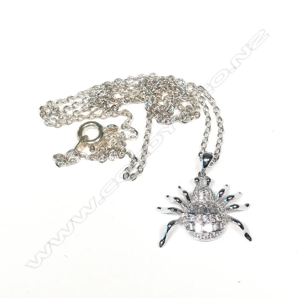An 18ct white gold and diamond pendant Image 1++