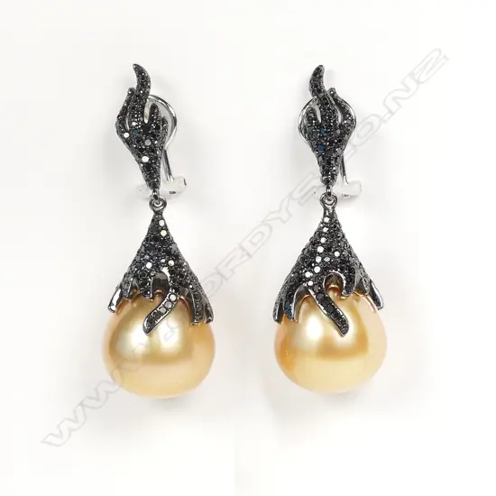 A pair of 18ct white gold diamond and pearl earrings