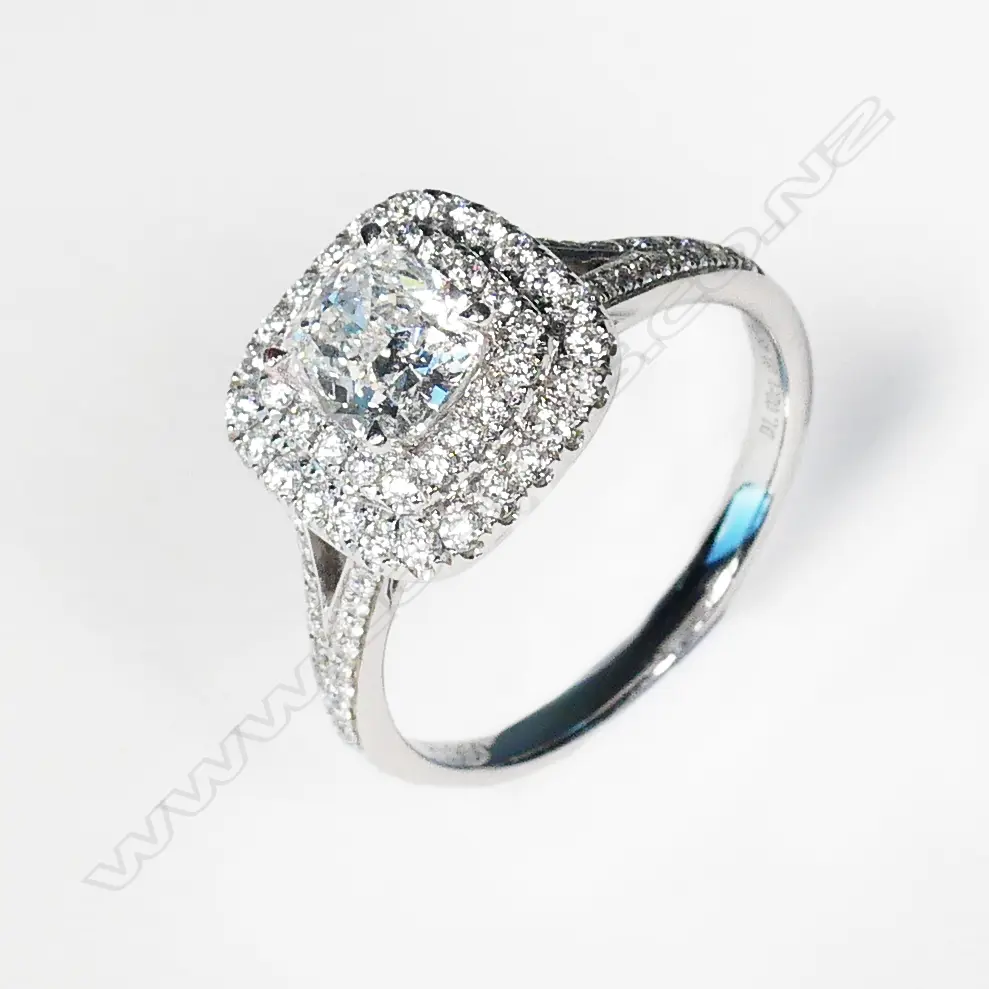 A platinum and diamond ring Image 1++