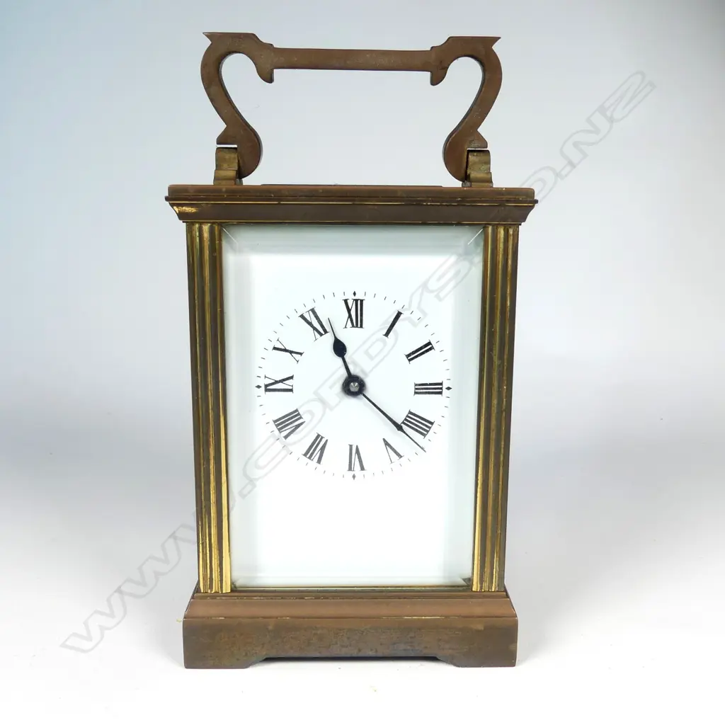 A brass cased carriage clock Image 1++