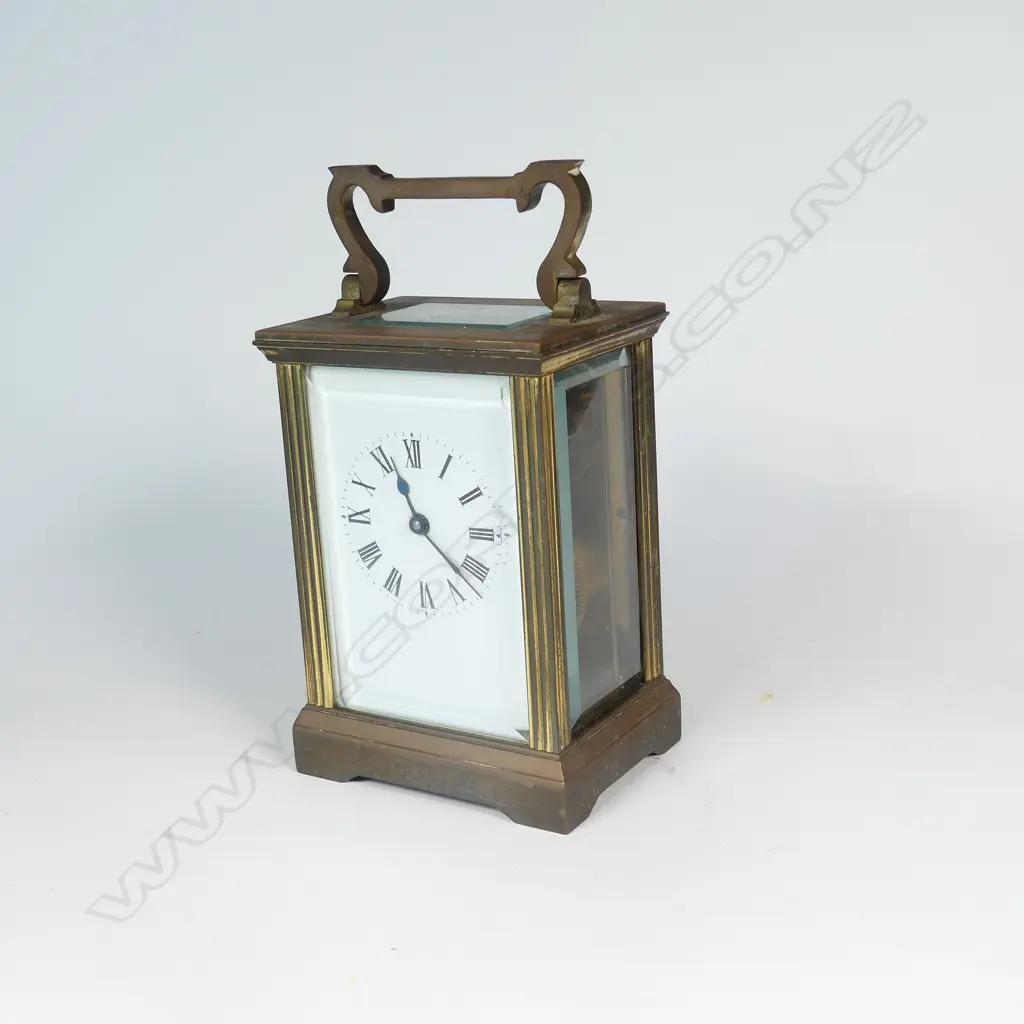 A brass cased carriage clock Image 1++