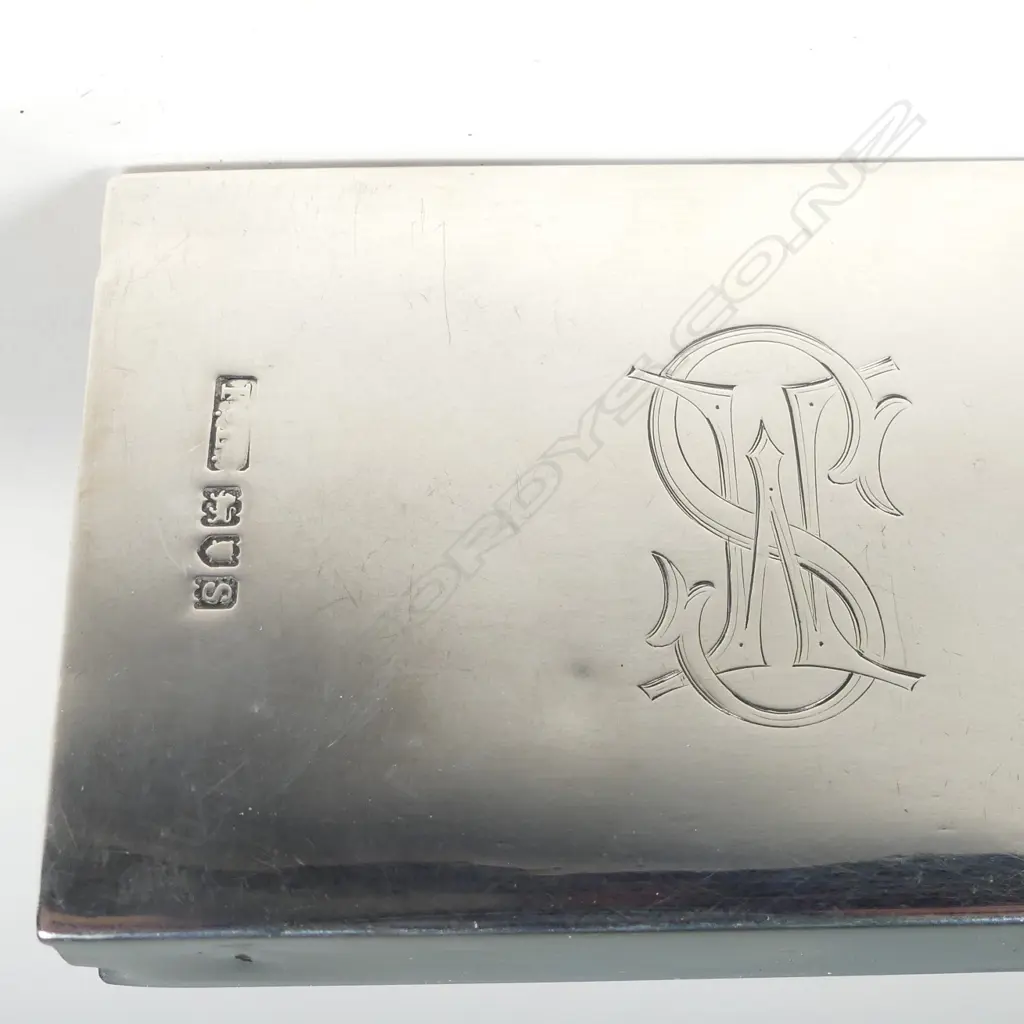 A silver match box frame Image 1++