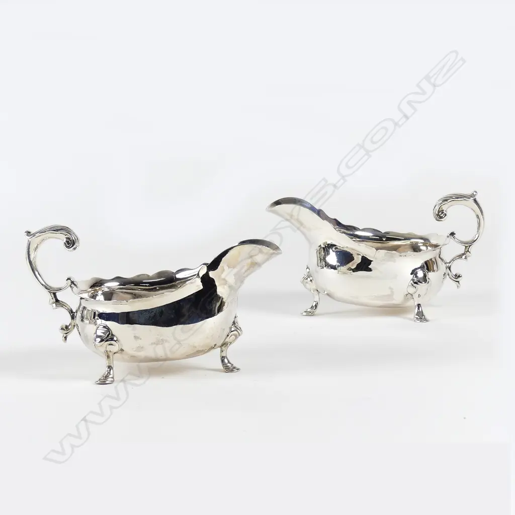A rare pair of George II silver sauce boats Image 1++