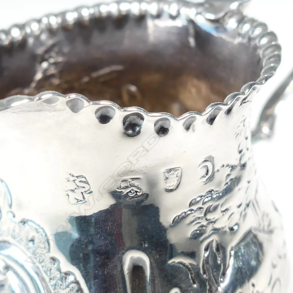 A George III silver helmet cream jug Image 1++