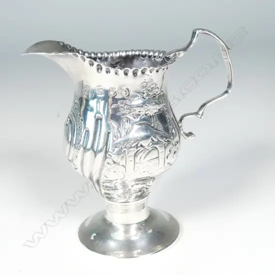 A George III silver helmet cream jug