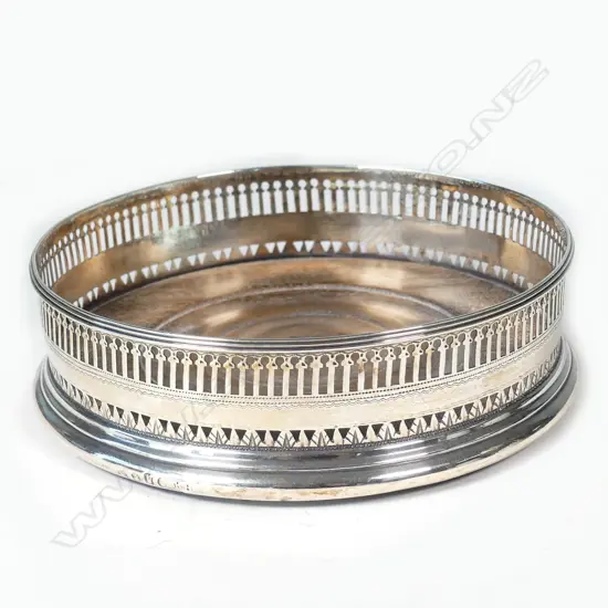 An elegant George III silver wine coaster