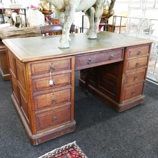 A late Victorian oak partners desk
